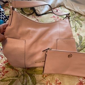 Michael Kors light pink shoulder bag with long strap w/mini clutch.
